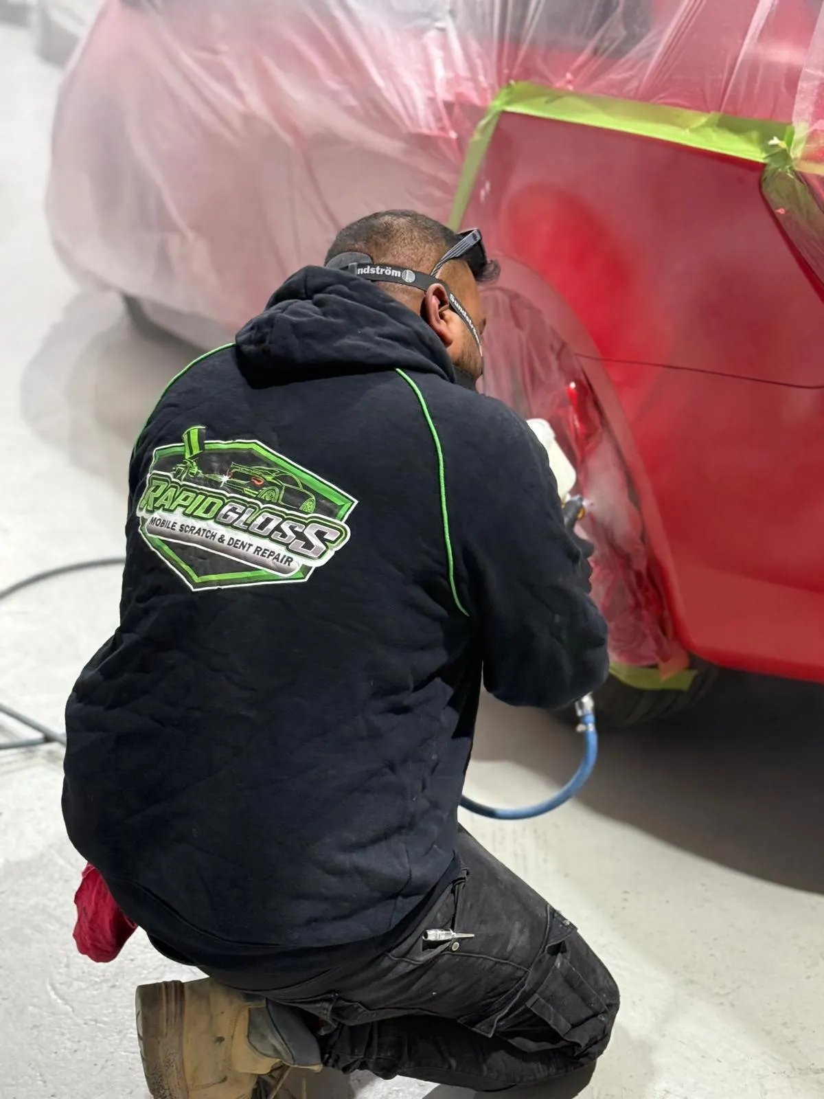 Rapid gloss team is repairing a car